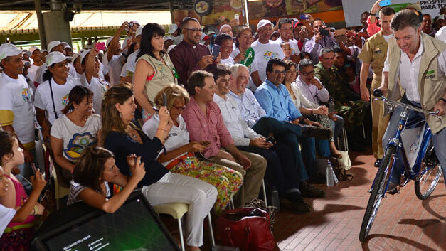 Santos falls off bicycle at public event