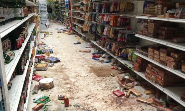 Bogota shopkeepers grab guns to defend stores against looters