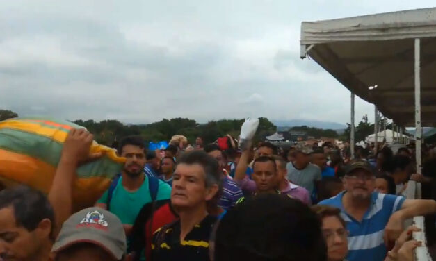 Venezuelans break through blocked border crossing to seek food in Colombia